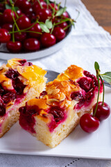 Fresh baked cake with red ripe juicy sour cherry or kriek berry