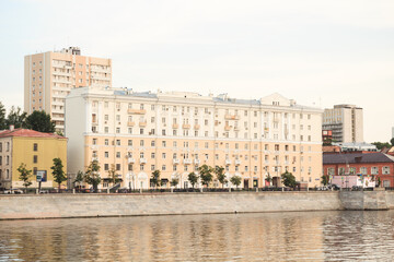 Fototapeta premium Moscow, Russia - June 9, 2020: Buildings on Savvinskaya embankment in summer. Stalin's architecture beside the Moscow river.
