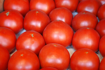 Ripe juicy red tomatoes background
