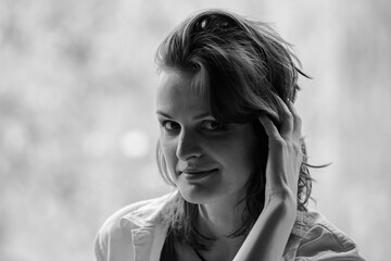 Nice black and white  close up portrait of young woman with emotions on face  in day light
