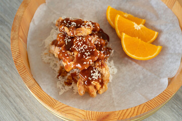Fried chicken with orange sauce