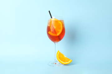 Aperol spritz cocktail on blue background. Summer drink