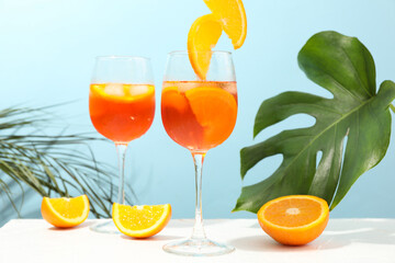Composition with aperol spritz cocktail on color background. Summer drink