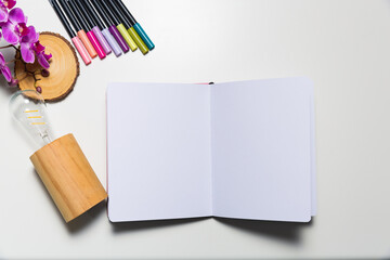 Art supplies on a white desk shot from high angle. Creative workplace concept