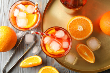 Composition with aperol spritz cocktail on wooden background. Summer drink