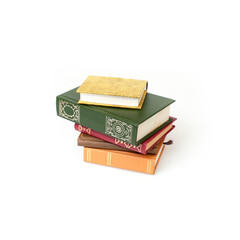 Stack of books in colour covers with white sheets isolated on a white background