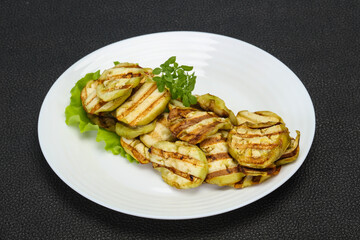 Grilled eggplant slices served basil