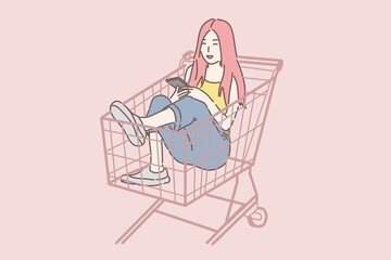 Happy woman sitting on shopping cart and hold smartphone.