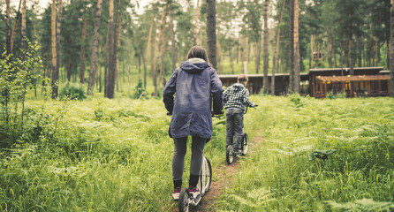 woman riding on push scooter