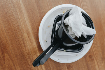 Plastic dishes after use. Food in plastic dishes in a cafe is a new reality during the coronavirus...