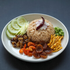 Kkao Kluk Kapi, Thai food, shrimp paste rice with shallot, roasted pepper, cucumber, mango, caramelized pork, dried shrimp, sausage, omelette and yardlong beans