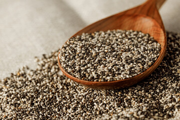 Wooden spoon with chia seeds close up