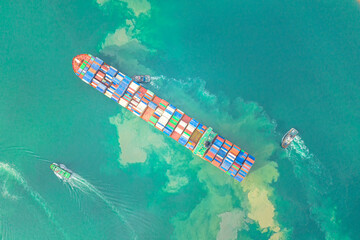 Container , container ship in export and import business and logistics. Shipping cargo to harbor by...