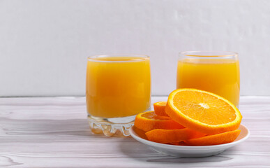 fresh rich of vitamin С citruses and 100% natural orange juice in glasses