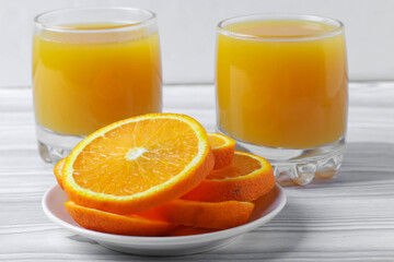 fresh rich of vitamin С citruses and 100% natural orange juice in glasses