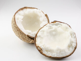 Coconut milk fruit halves split on background. Health Benefits Contains Lauric acid to help...