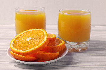 fresh rich of vitamin С citruses and 100% natural orange juice in glasses