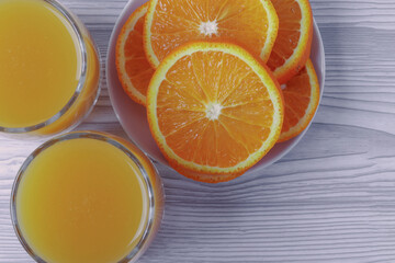fresh rich of vitamin С citruses and 100% natural orange juice in glasses