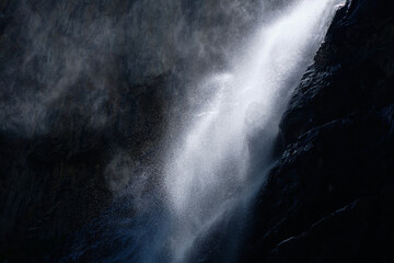 water falling at high speed in a ray of light