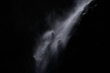 water falling at high speed in a ray of light