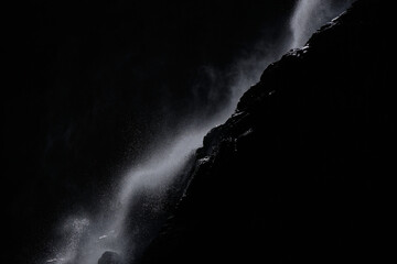 water falling at high speed in a ray of light