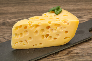 Maasdam cheese - yellow triangle with holes