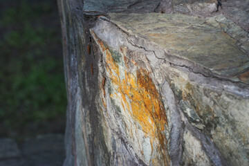 Natural stone in orange and gray in natural light. Textures and backgrounds of natural origin.