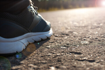running shoes on the pavement during the morning jog