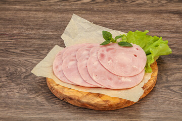 Slised ham snack over board