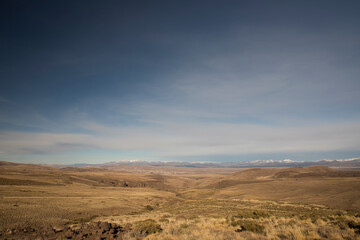 Autumn colors. Golden valley. View of the yellow grassland and meadow in the mountains. 