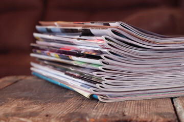 Old magazines on wooden table