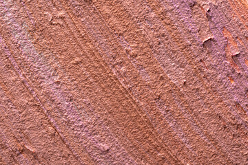 Textured smears of dark skin foundation, background