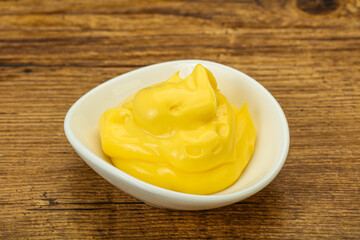 Natural cheese sauce in the bowl