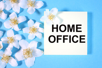 the inscription on the sticker on a blue background with flowers. home office.