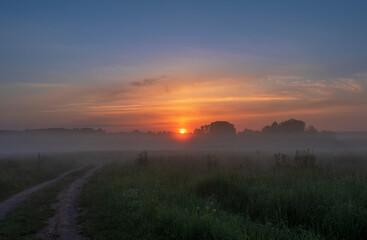 Sunrise in the early foggy morning