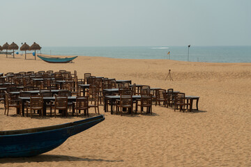 Ocean beach with cafe tables, Colombo, Sri Lanka