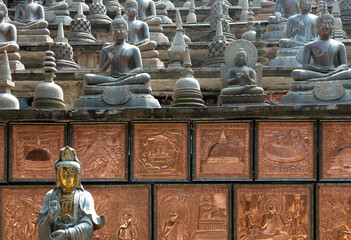 Many Buddha statues, Colombo, Sri Lanka, Gangaramaya Buddhist temple architecture.