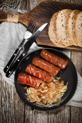 Fried sausage with onion.