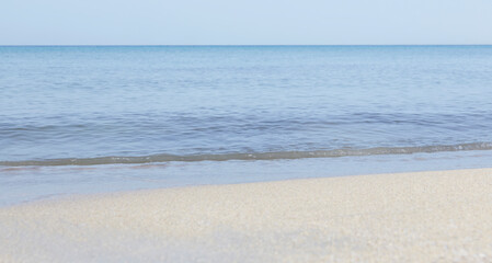 Obraz premium Close-up of white sand, washed by soft sea waves