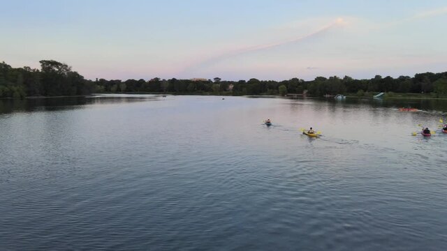 aerial view of group of kayakers enjoying outdoors during summer time in lake of the isles, minneapolis