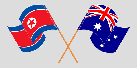 Crossed and waving flags of North Korea and Australia