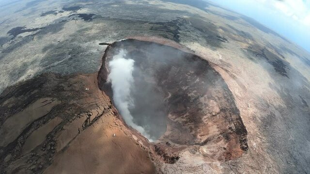 Crater of volcano Mauna Loa, Big Island, Hawaii, with smoke (helicopter flight, aerial)