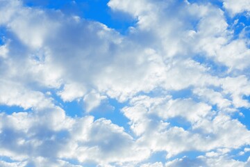 Beautiful shot of white puffy  clouds on a blue sky