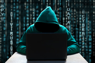 A computer hacker in the hood, with a hidden face, sits in front of a laptop, against a background...