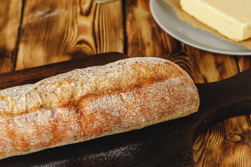 Fresh baked loaf of bread with butter bar