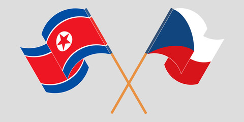 Crossed and waving flags of North Korea and Czech Republic