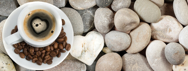 image of cups with coffee on stones and a stylized heart