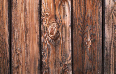 Wood texture. Old grey and orange boards with knots. Wood wallpaper. Wood background