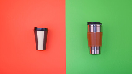 Refillable and disposable coffee cups on half red and green background. Plastic-free and zero waste living concept.