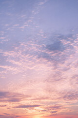 Naklejka na ściany i meble Dramatic cloudy pastel colored sunset sky